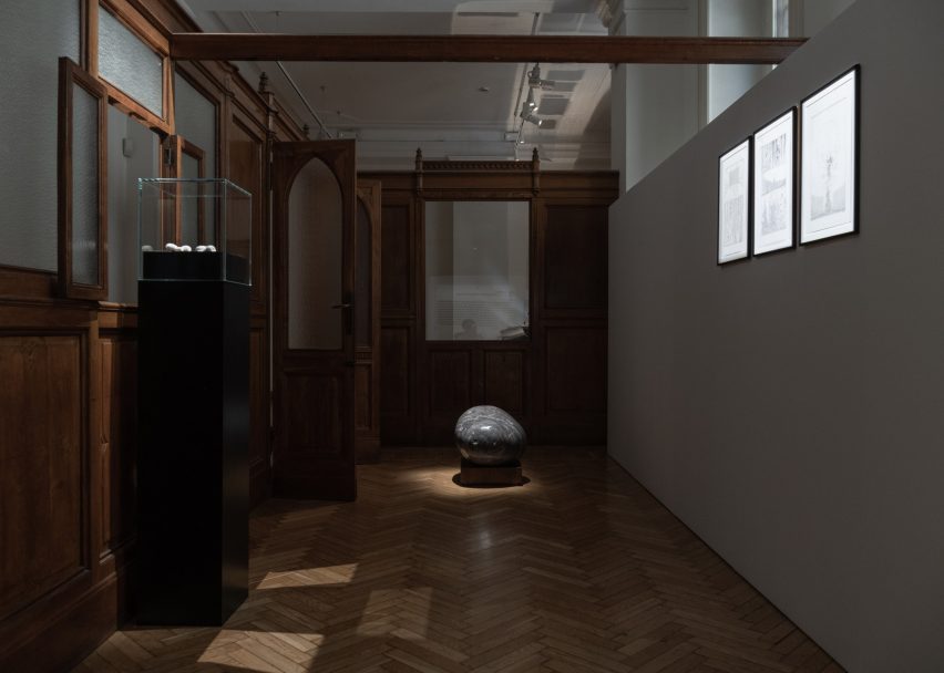 A gallery with a rock
