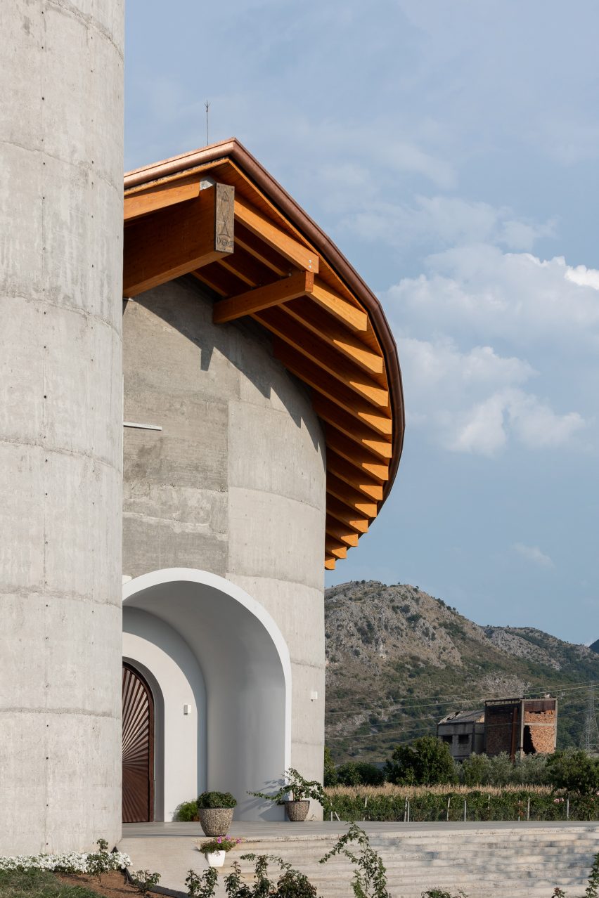 Entrance to a concrete religious building in Albania by Arkpro Studio