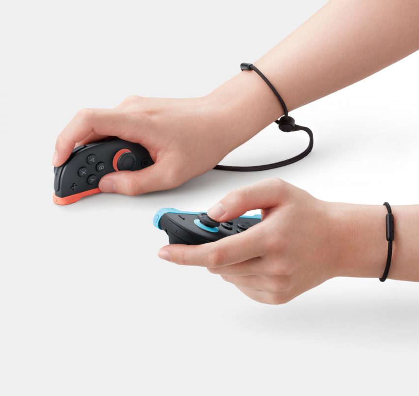 Image of a person's hands using the Nintendo Switch 2 Joy-Con controllers with one face down like a mouse