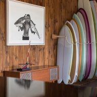 Surfboards stacked in a reception area