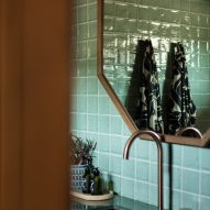 Tiled bathroom sink with two patterned robes