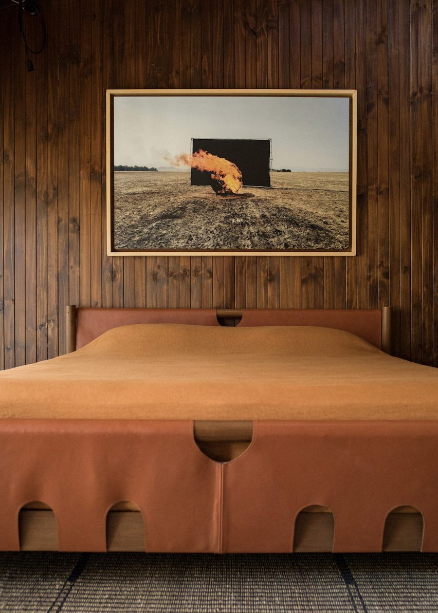 Dark stained wood panelled bedroom