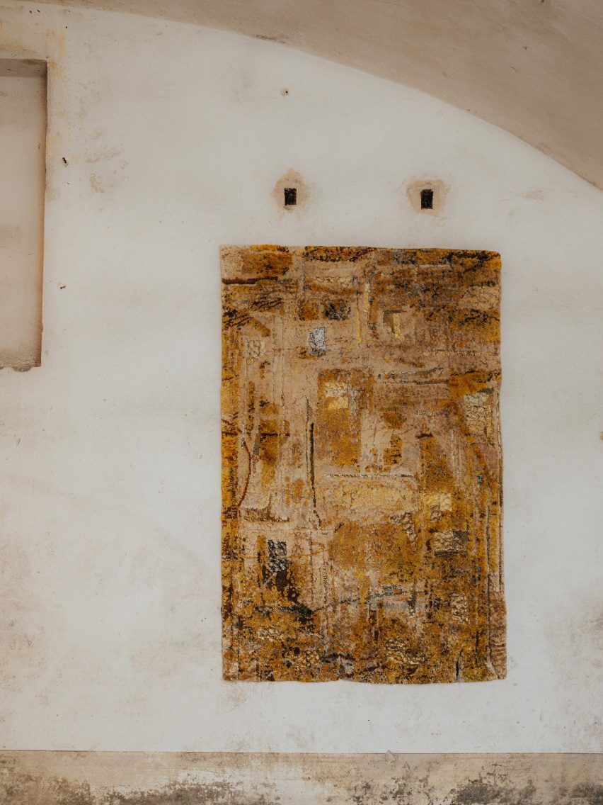 Yellow rug on a wall