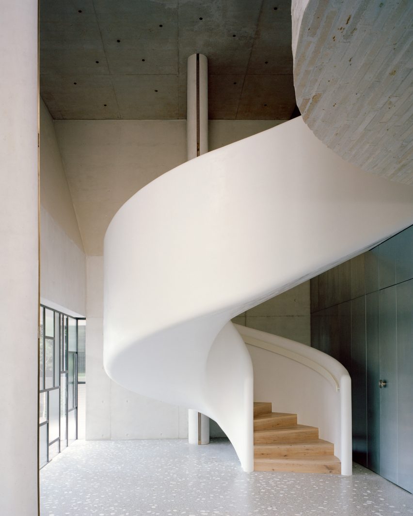 View of spiral staircase within family home by Pandolfini Architects