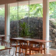 Mounded stones outside glass facade across cafe