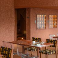Terracotta walls and woven chairs
