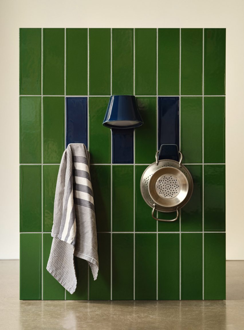 Blue and green tiles that double as lamps and hooks in a kitchen