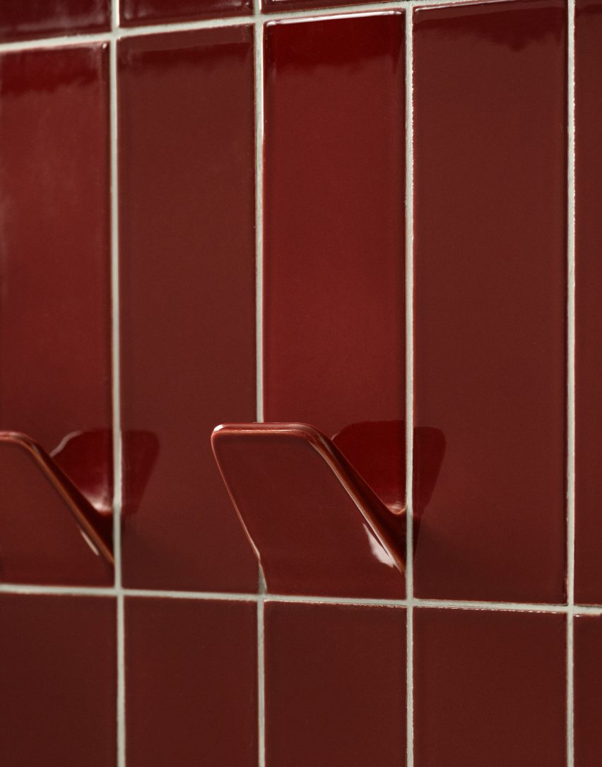 Close-up of hook coming out of red ceramic tile