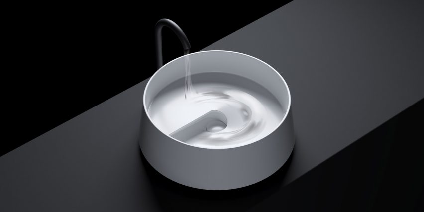 Image of a white circular fine ceramic sink with a sculptural interior that makes the water rotate in a spiral as it flow through the bowl