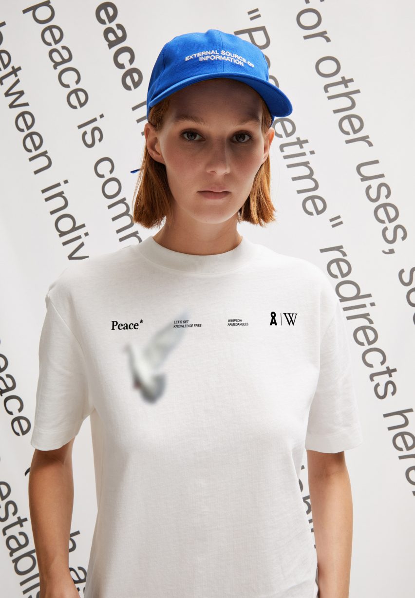 Person wearing a blue hat and white Tshirt from Wikipedia fashion collection 