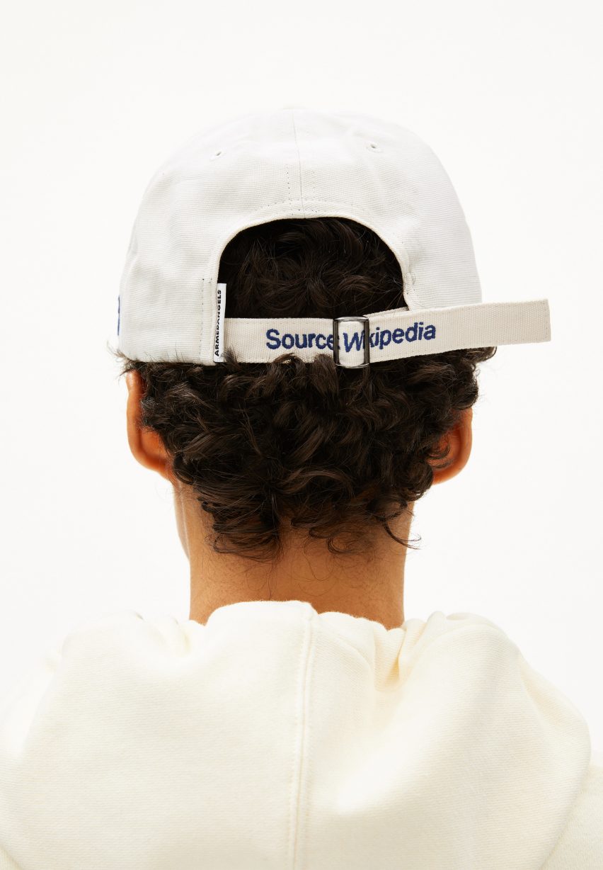Back of cap reading "Source: Wikipedia" from streetwear collection by Wikimedia Foundation and Armedangels