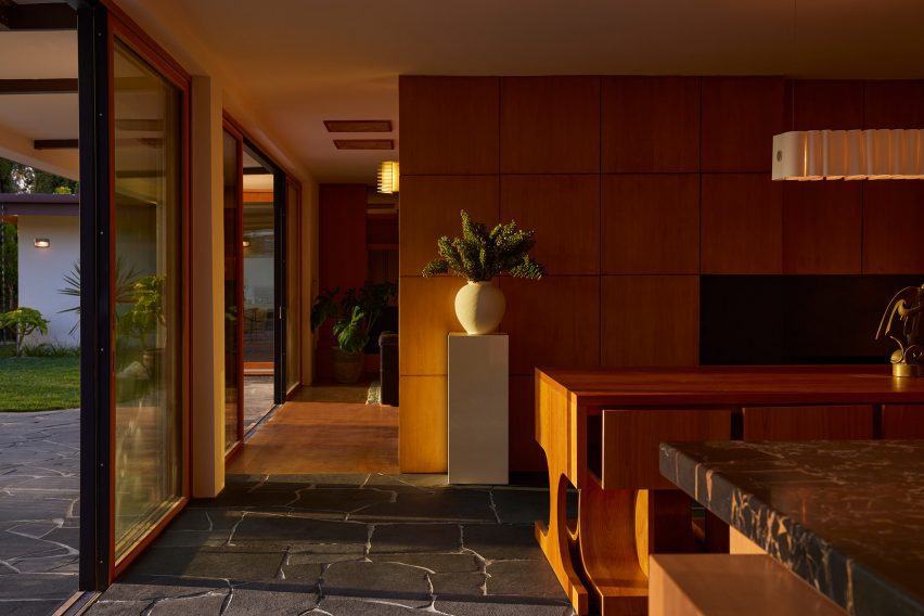 Dining area with warm Douglas fir wood panelling
