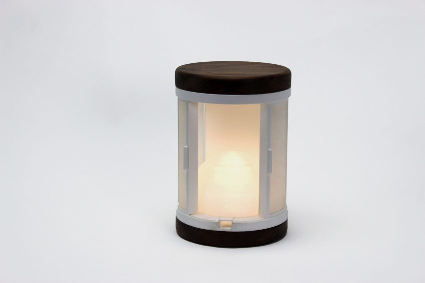 a photograph of a cylindrical lamp