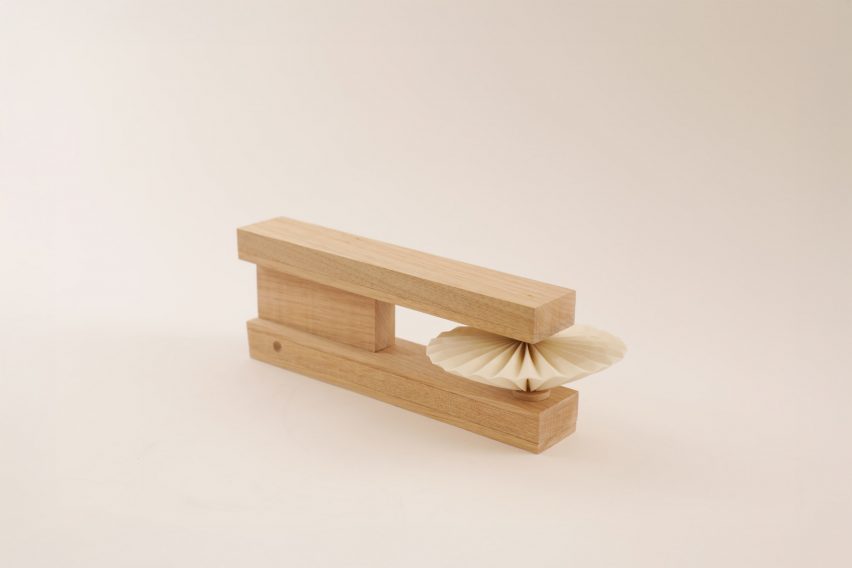 a photograph of a rectangular wooden object that acts as a timer