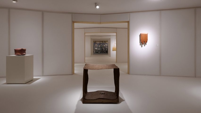 Exhibition space with spotlit exhibits for Loewe Foundation Craft Prize 2025