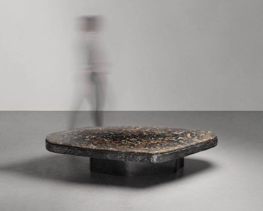 Table with brass base and resin top