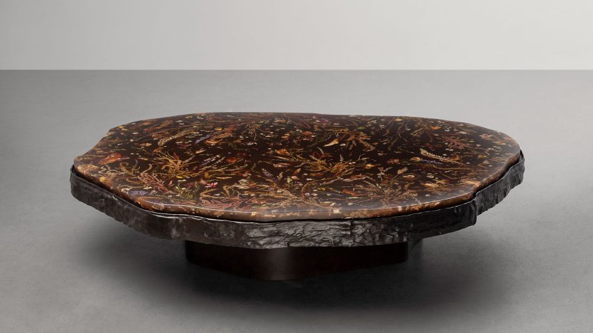 Table with brass base and resin top