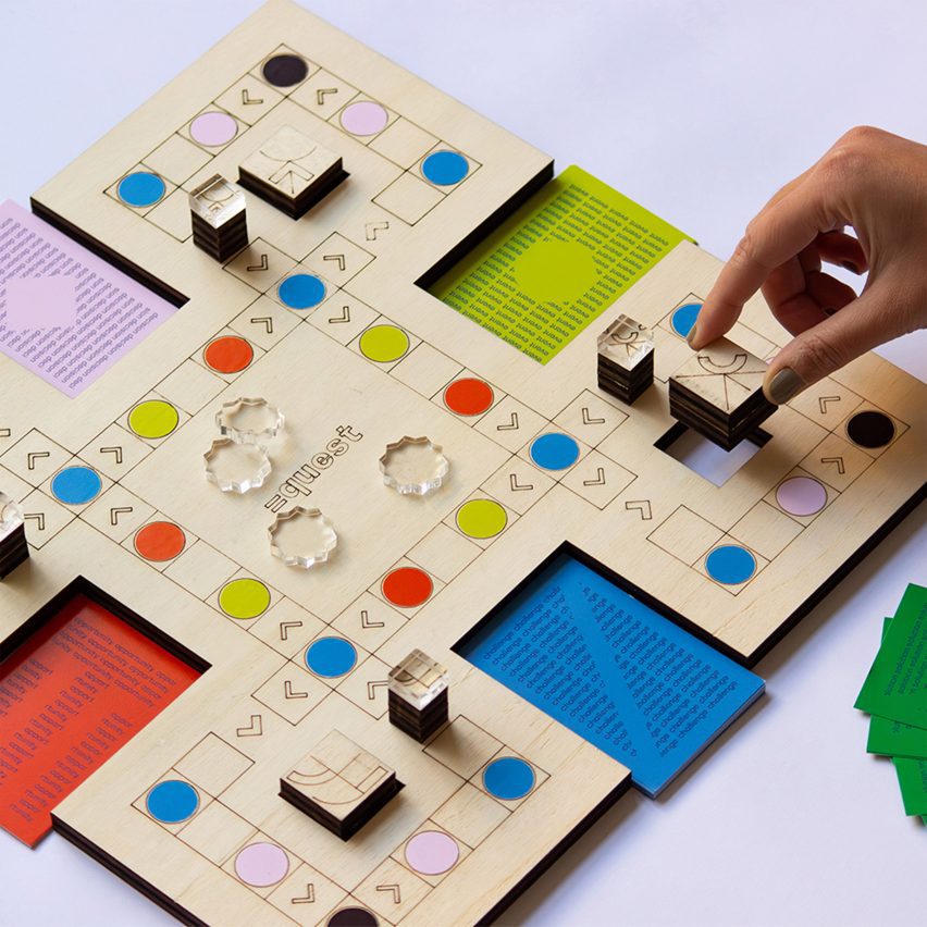 a photograph of a person interacting with a board game in tones of blue, green, red and pink