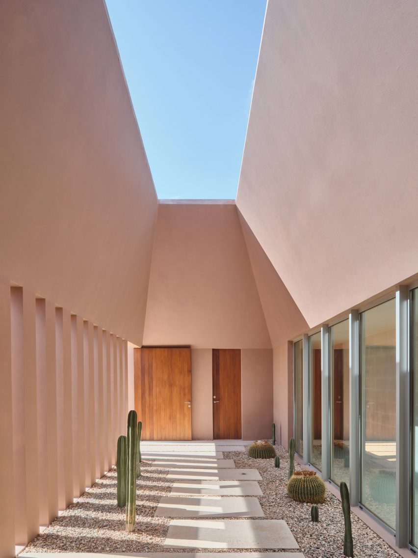 Patio space within holiday home by Nomo Studio