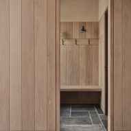 Timber walls inside Two-Family House by Rundell Associates