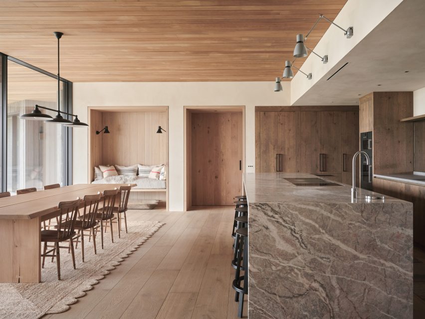 Kitchen and dining room in Two-Family House by Rundell Associates