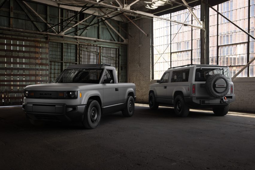 Photo of two Slate Trucks parked in a hangar