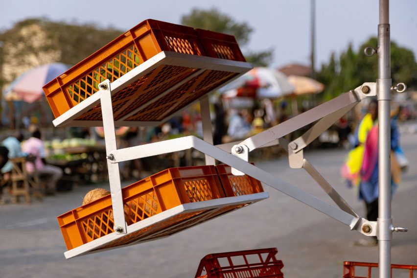 Extendable crate holders on Umbrella Crate Stall by Paul Yakubu
