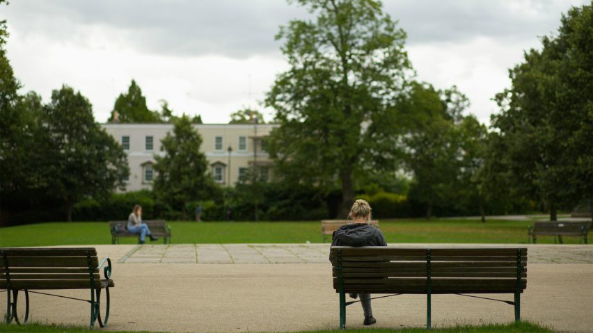 Women sitting on benches in park