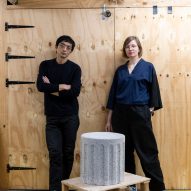 Photograph of the designers posing with a stool from the collection.