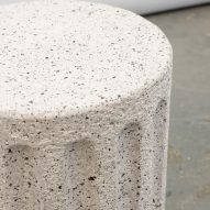 Close up photograph of a stool from the collection showing its composition from rubber erasers.