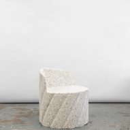 Photograph of the white granite-looking armchair.