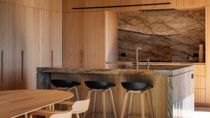 Timber-clad kitchen featuring appliances by Fisher & Paykel