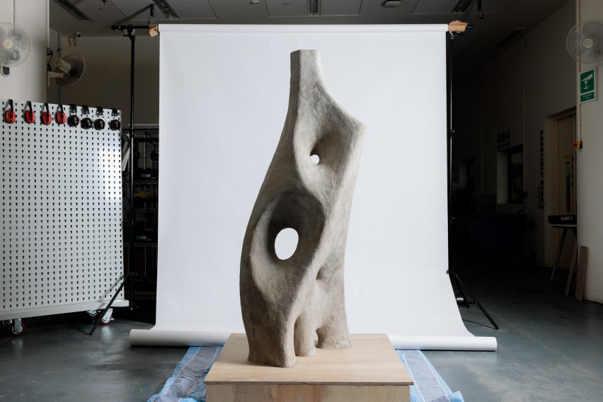 a photograph of a grey concrete sculpture 