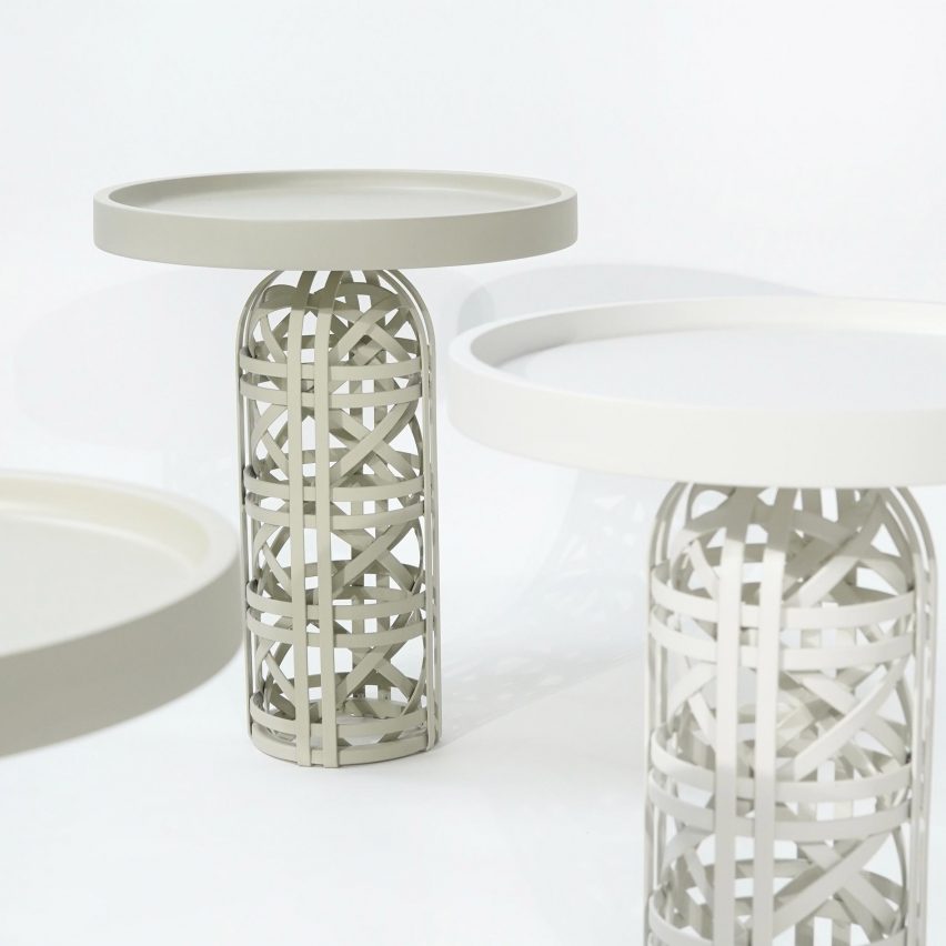 Photo of white side tables with woven bases