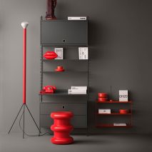 Photo of a grey with red furniture and accessories