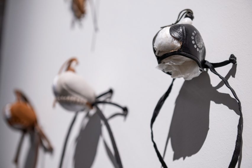 Photo of art pieces on a wall inspired by Qatari artefacts