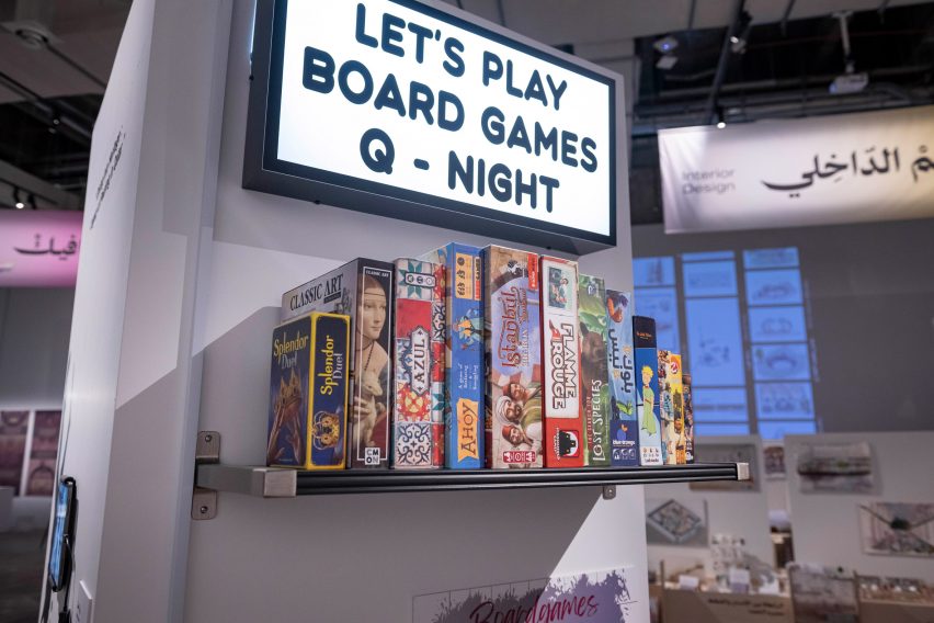 Photo of a sign and board games on a shelf