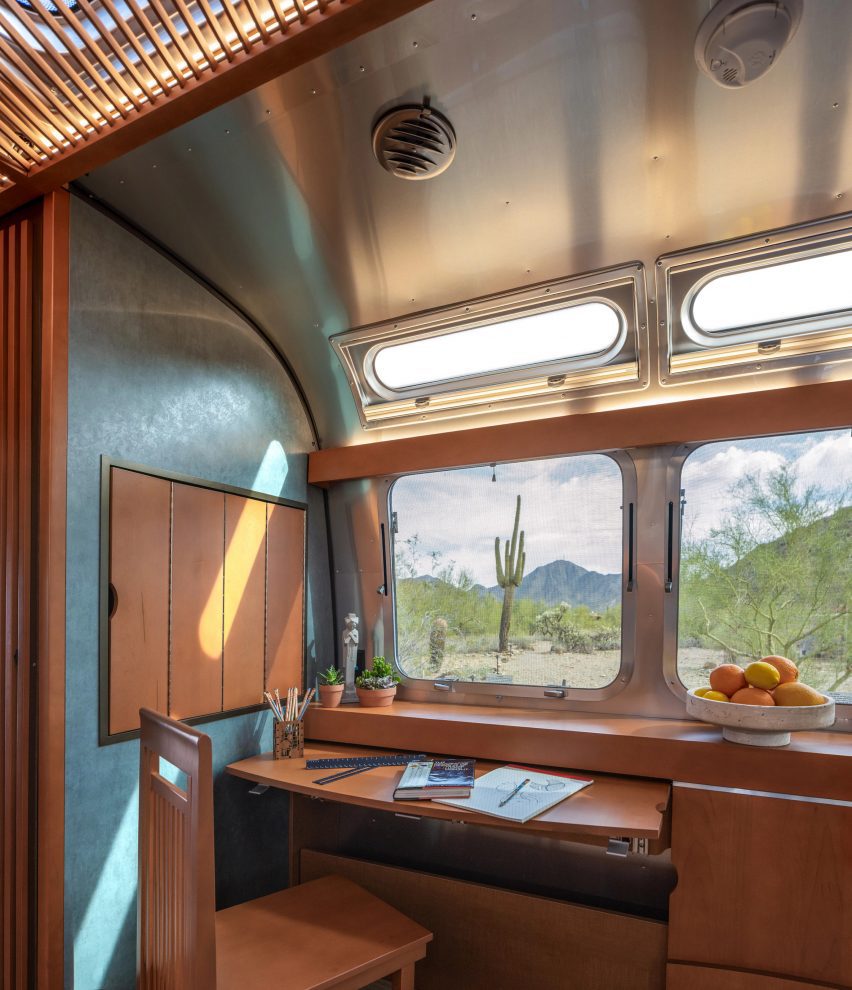 A small desk inside Frank Lloyd Wright Airstream trailer