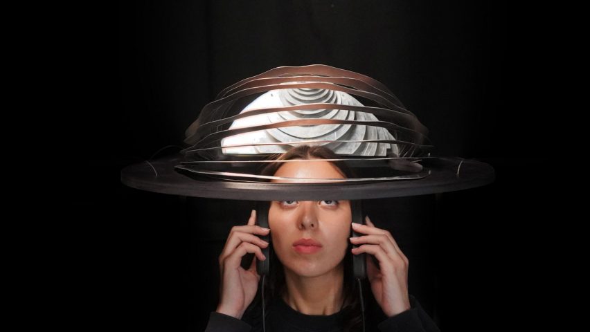 a photograph of a person wearing a spherical headpiece device 