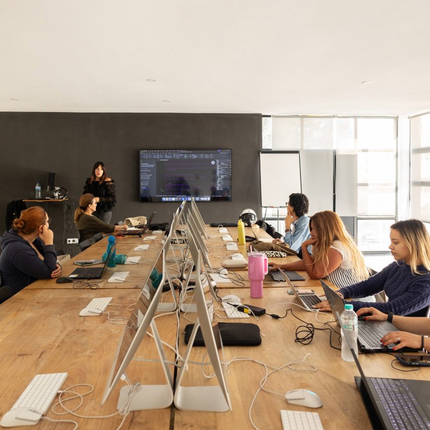a photograph of students in a computer suite at a university 