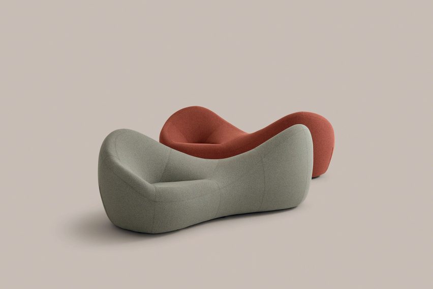 Two curving upholstered benches, one grey and one red