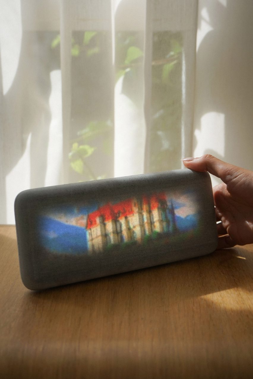 Photo of the Dream Recorder showing a still of a grainy video with a brightly coloured, massive stone castle 