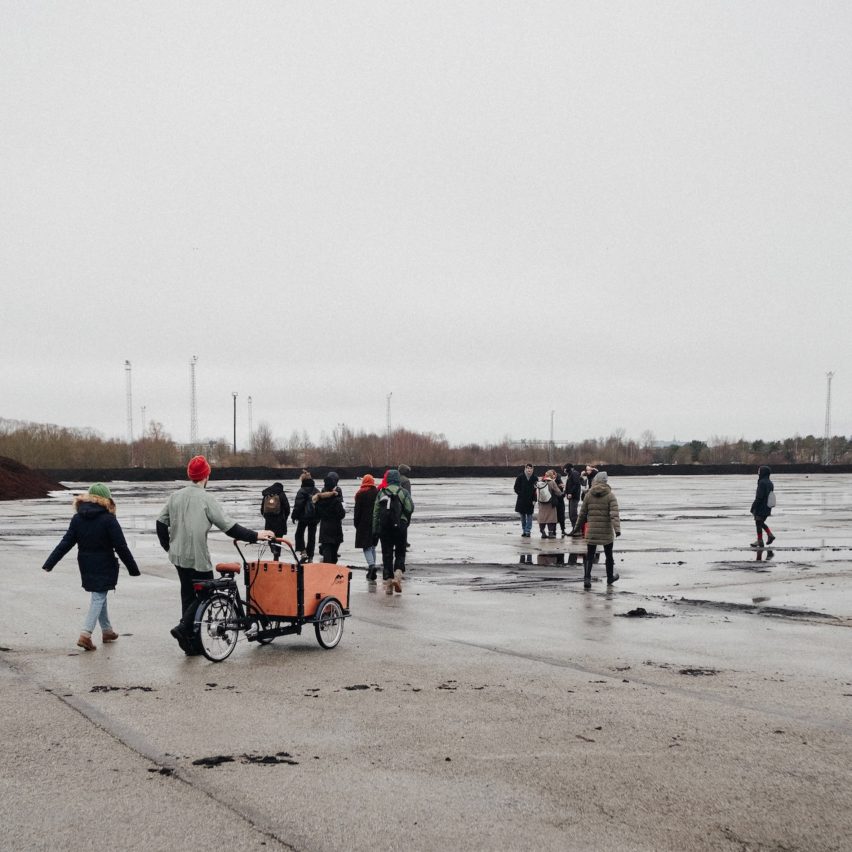 a photograph of people on a concrete site