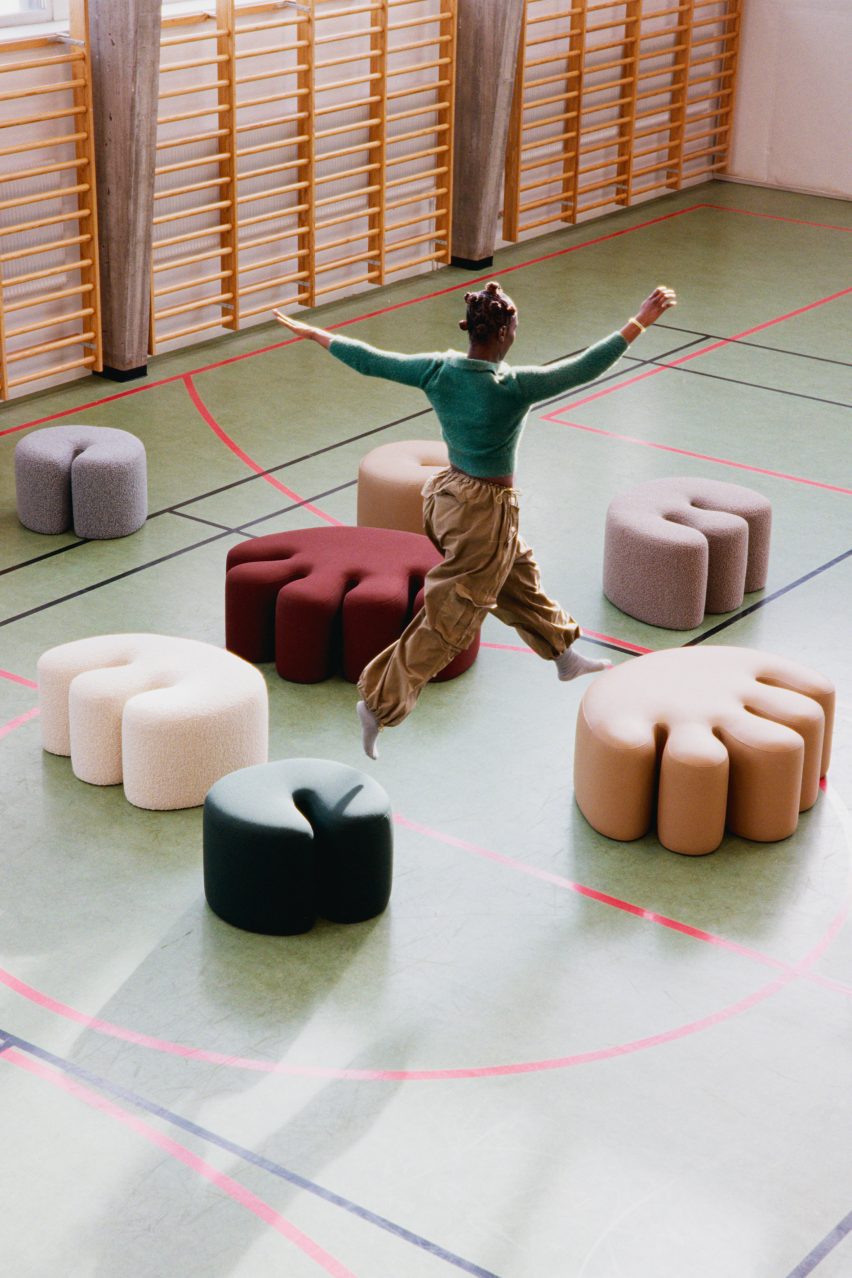 Person jumping over Palma poufs by Kusheda Mensah for Hem