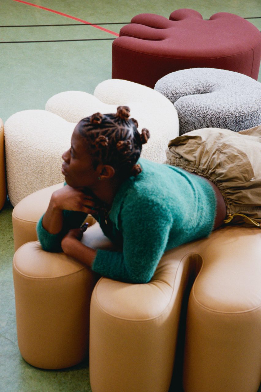 Kusheda Mensah lying on a pouf she designed for Hem