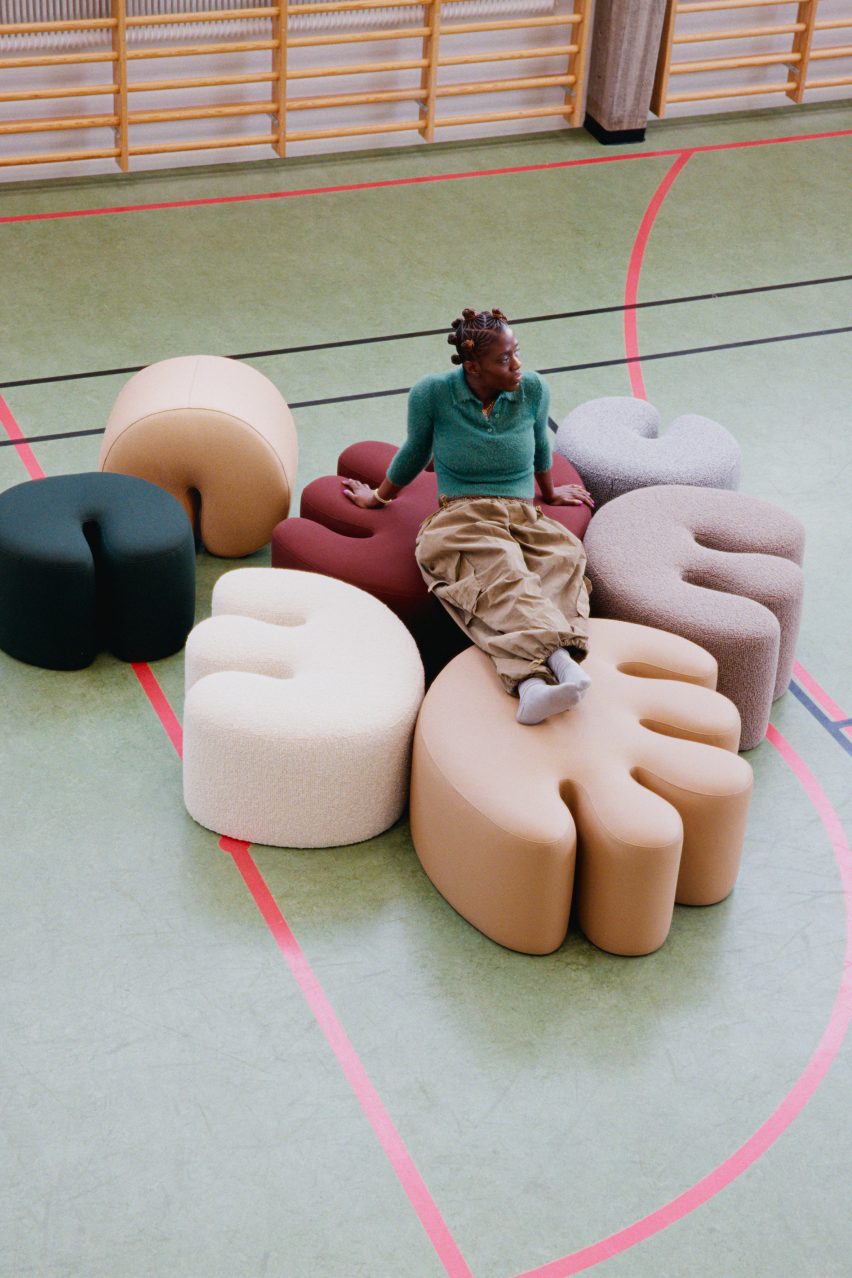 Kusheda Mensah sitting on poufs