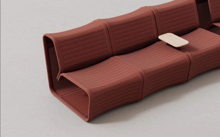 Image of three modules of the Isomi Knit One seating system joined together with a side table between two modules