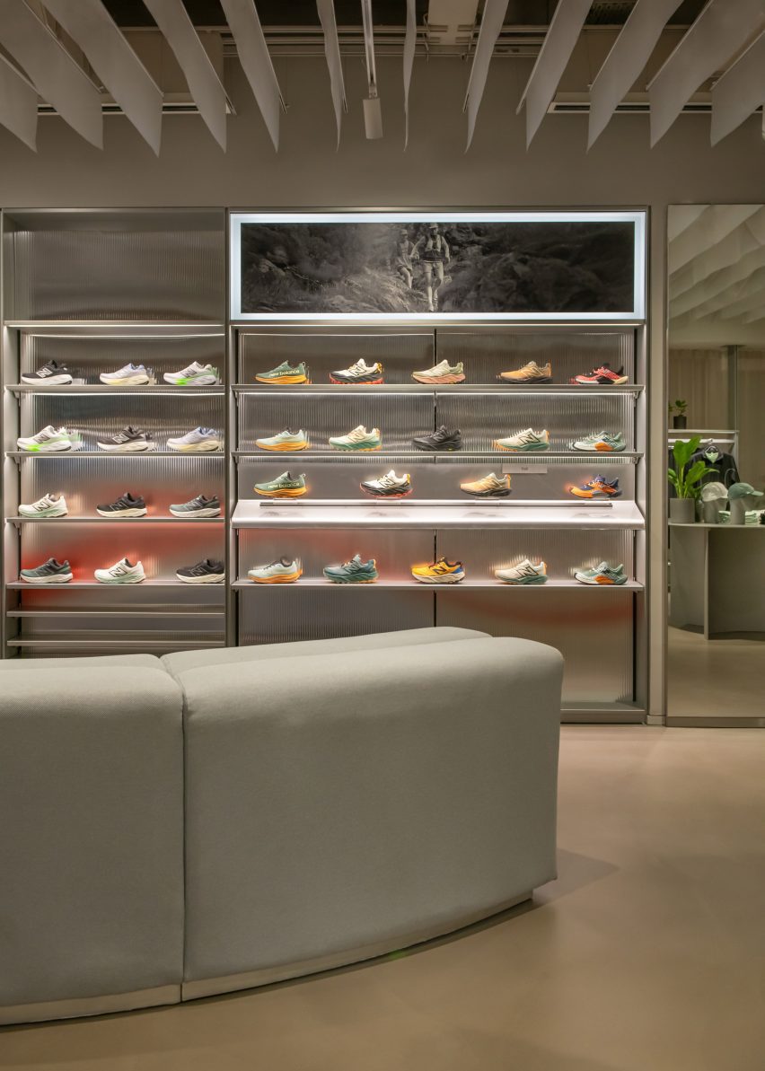 Metal shelves displaying shoes in New Balance London flagship