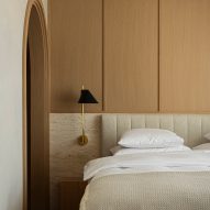 Bedroom with travertine and wood headboard