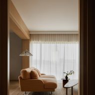 Dusty orange sofa in Puro hotel Warsaw guest room